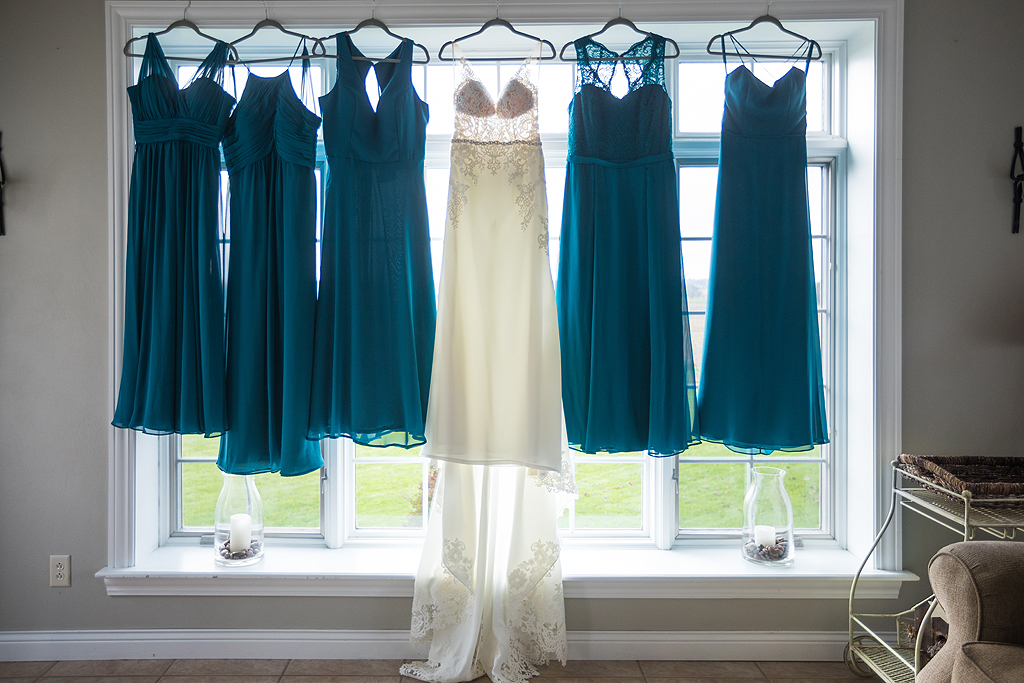 bride and bridesmaids dresses hanging