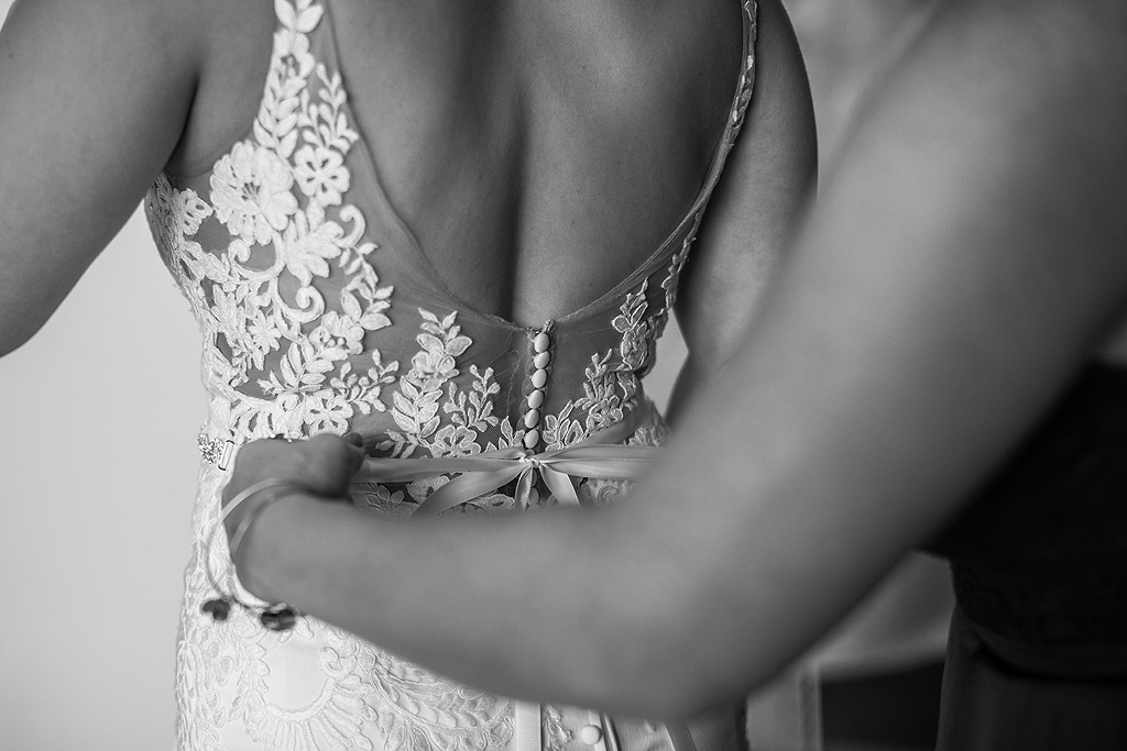bride's dress has a bow