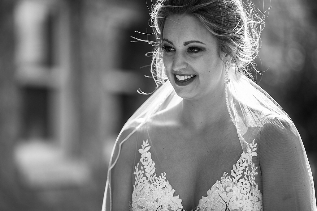 bride smiling in black and white