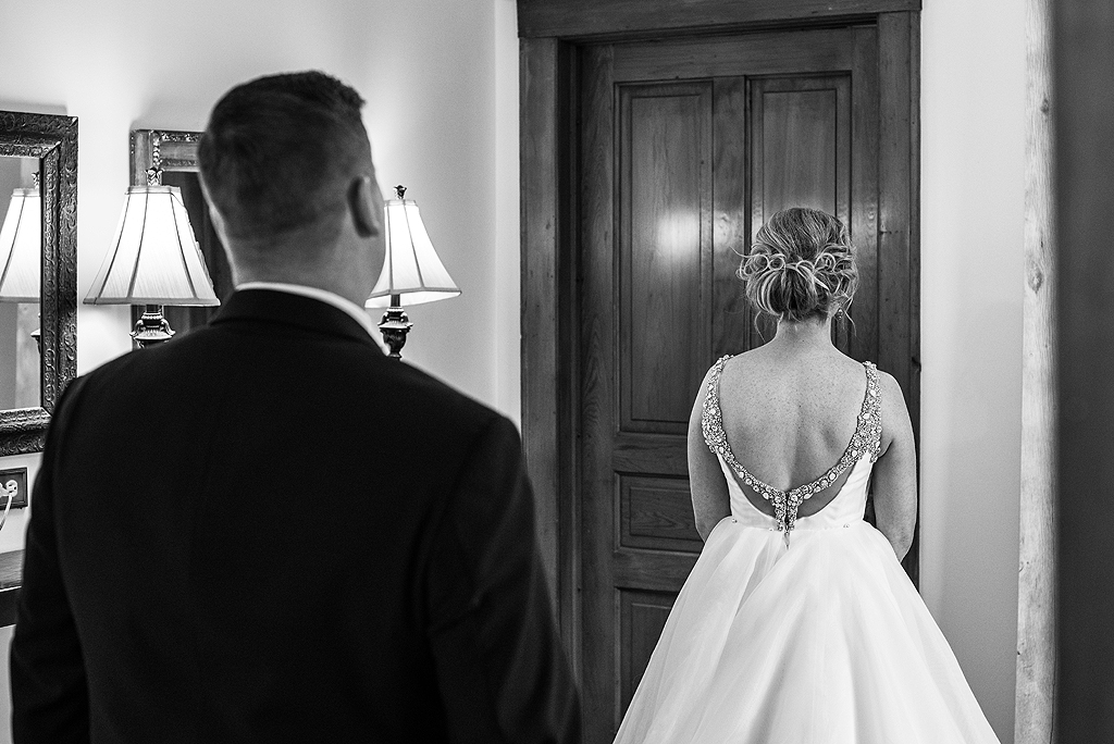 bride and groom share their first look at The Haight in Elgin Illinois