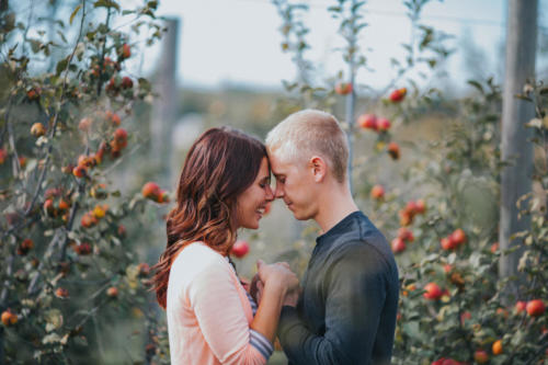ENGAGEMENT PHOTOGRAPHY SESSION  in an orchard